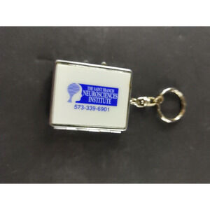 The Saint Francis Neuroscience Institute Pill Bottle Change Keychain